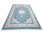 Persian Nain blue machine made carpet 400x300cm featuring ivory floral medallion and traditional cream and beige borders