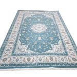 Persian Nain blue machine made carpet 400x300cm featuring ivory floral medallion and traditional cream and beige borders