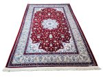 Persian Nain red machine made carpet 300x200cm featuring an ivory floral medallion and traditional cream and blue borders
