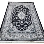 Persian Kashan navy blue machine made carpet 300x200cm featuring a silver-grey floral medallion and traditional ivory borders